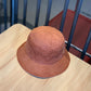Corduroy fisherman hat in rust-brown, foldable bucket style with short brim