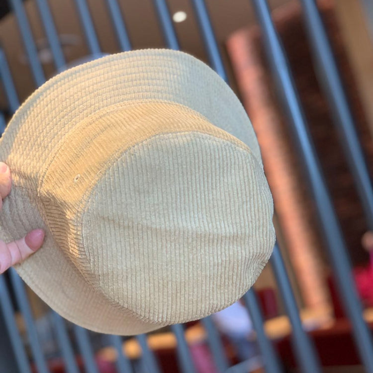 Beige corduroy fisherman hat with short brim and stitched crown