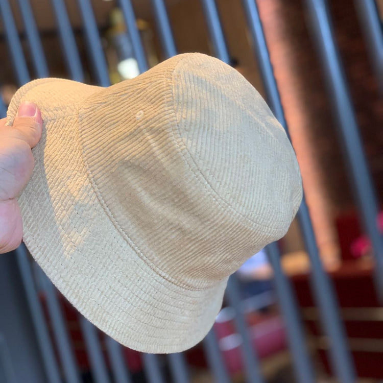 Light tan corduroy fisherman hat, foldable bucket shape with stitched seams