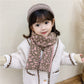 Child wearing knitted leopard-pattern scarf, mauve and brown, winter outfit