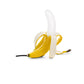 Banana-shaped table lamp with yellow banana body and white bulb, lying pose