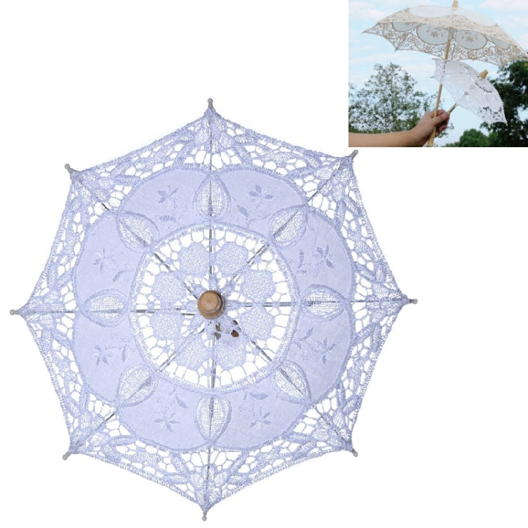 Lace bridal umbrella with pale blue fabric panels and circular floral motif center