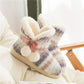 Pair of multicolor knit home boot slippers with fluffy trim and pink bow, thick outsole