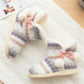 Home boot slippers featuring multicolor knit fabric, soft plush lining, pink bow
