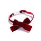 Velvet pet collar with red bowknot and adjustable strap, no bell.