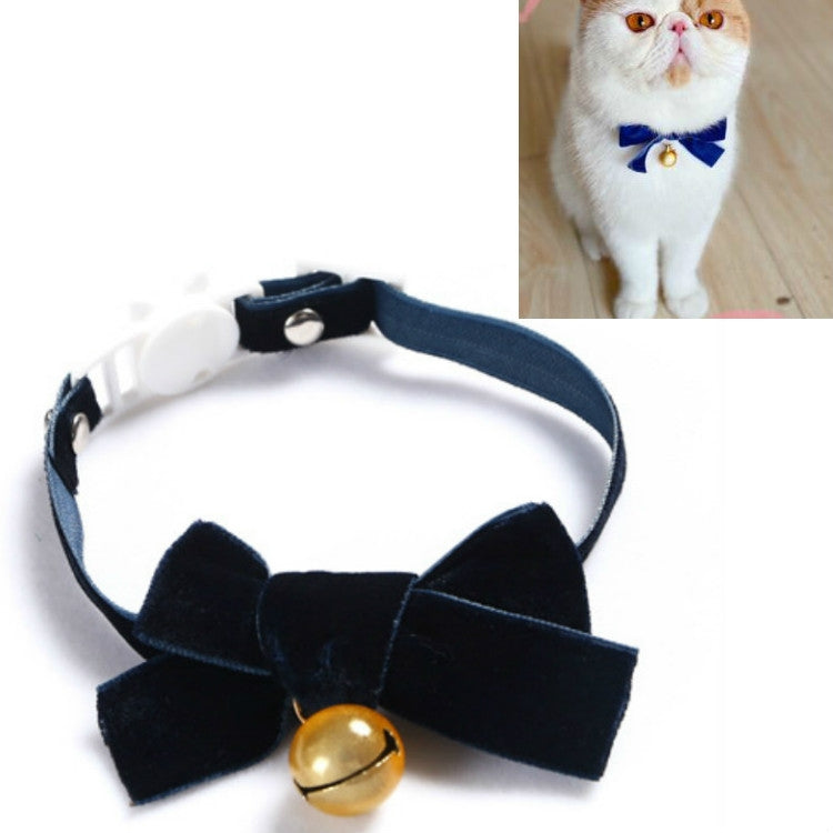 Velvet pet collar with dark navy bowknot and bell, adjustable strap.