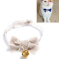 Beige velvet bow pet collar with adjustable strap and small gold bell.