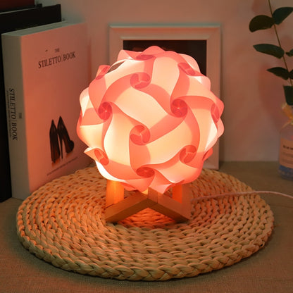 Pink USB bedside night light with wood base, round paper-flower shade, glowing
