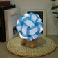 Blue USB bedside night light with wood base, round paper-flower shade, glowing