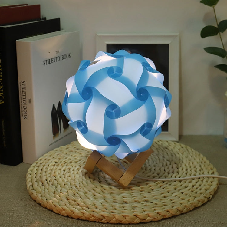 Blue USB bedside night light with wood base, round paper-flower shade, glowing