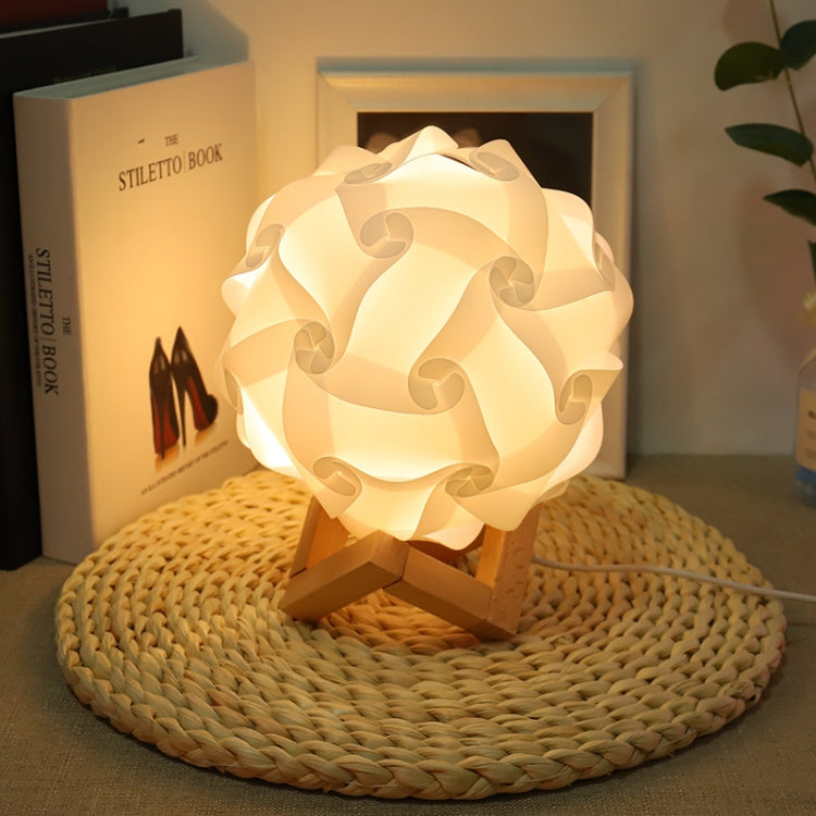 White USB bedside night light with wood base, round paper-flower shade, softly glowing