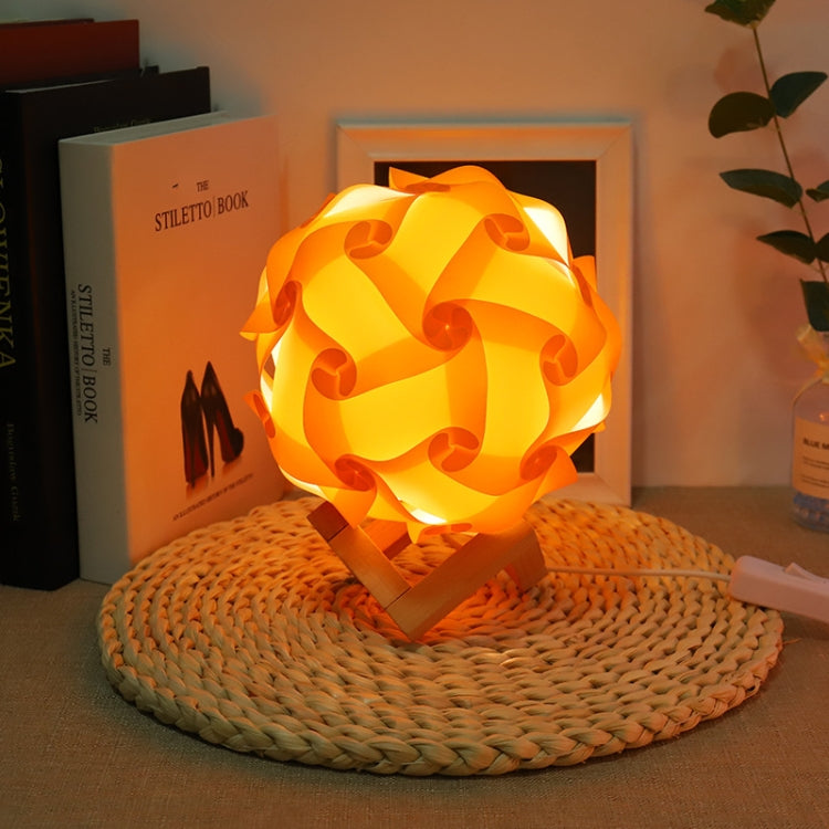 Orange USB bedside night light with wood base, round paper-flower shade, glowing