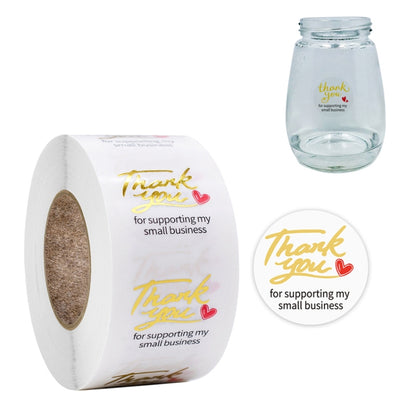Transparent thank-you sealing stickers with gold script on roll and round labels