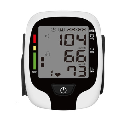 White wrist electronic blood pressure monitor with LCD showing 108/66 and pulse rate