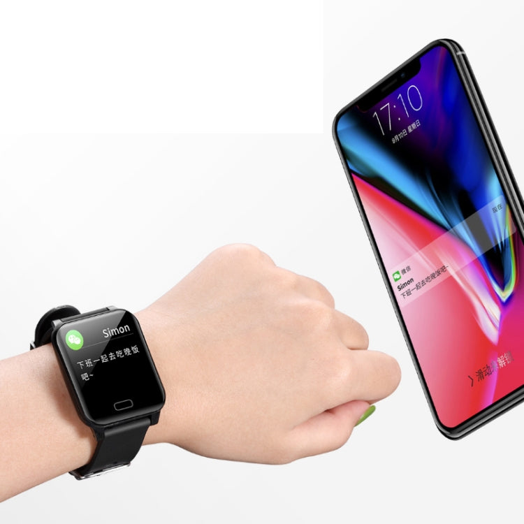 Black smart bracelet on wrist with smartphone nearby showing a colorful app screen