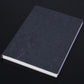 Dark gray PU notebook with embossed floral design, white page edges