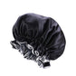 Dark satin round sleep hat with gathered crown and light gray ruffle trim