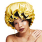 Double-layer satin round night hat in yellow with black lace-like trim and gathered brim