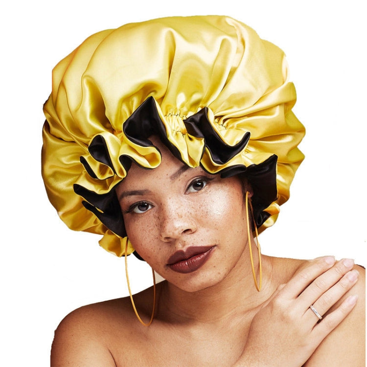 Double-layer satin round night hat in yellow with black lace-like trim and gathered brim