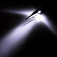 LED light from eyebrow tweezer tip, bright focused beam over metal surface