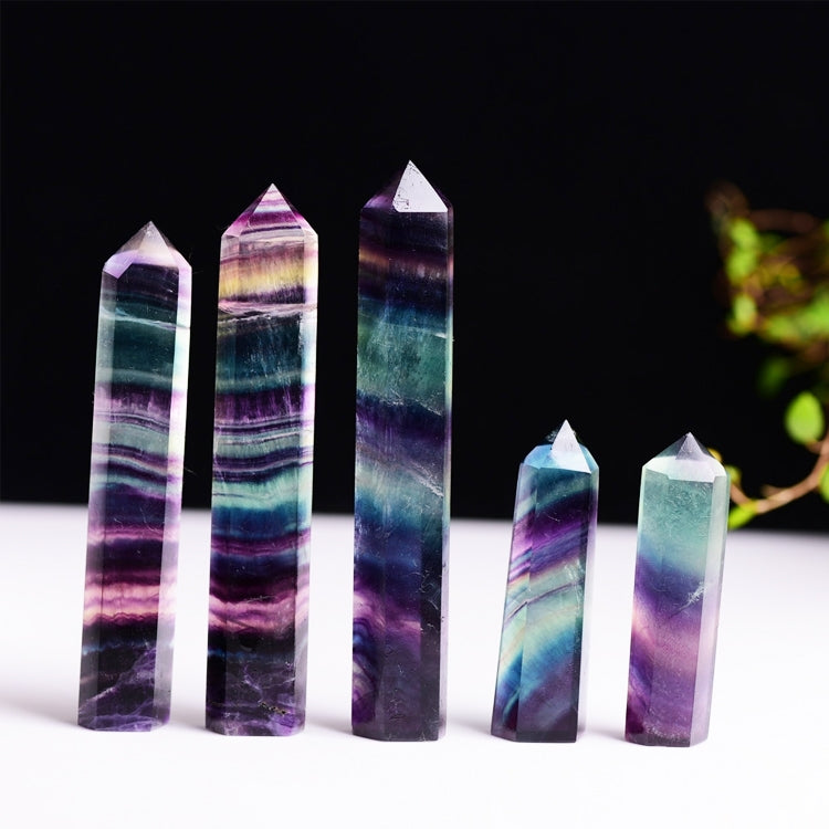 Group of multicolor fluorite crystal hexagonal column ornaments with faceted points