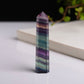 Tall hexagonal fluorite crystal column ornament with purple, blue, and teal color bands