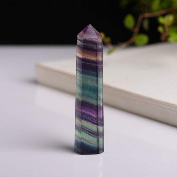 Tall hexagonal fluorite crystal column ornament with purple, blue, and teal color bands