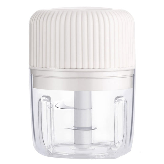White mini electric garlic masher with ribbed lid and stainless blade inside clear jar