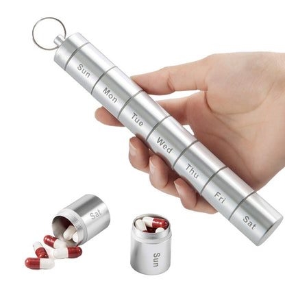 Aluminum 7-day pill organizer with key ring, labeled compartments for Sun–Sat