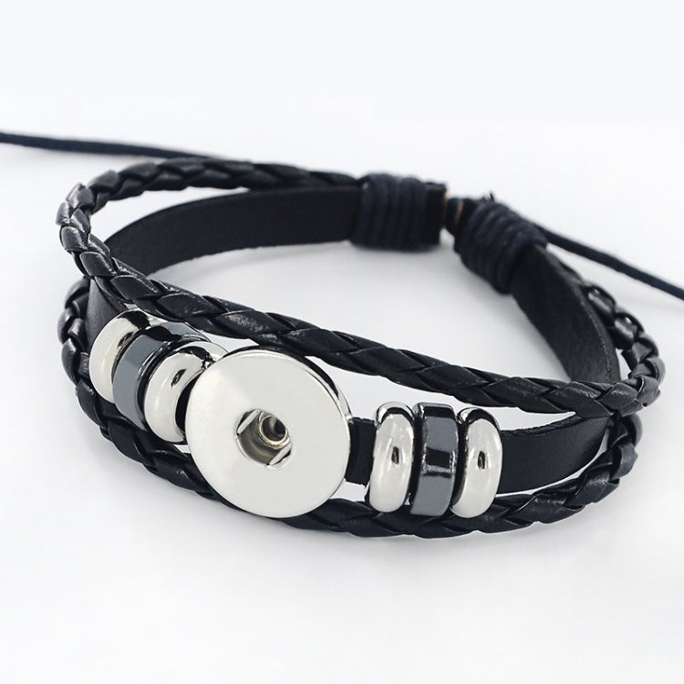 Black braided leather bracelet with metal rings and turquoise zodiac centerpiece
