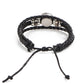 Black leather wrap bracelet with round metal accents and turquoise zodiac charm
