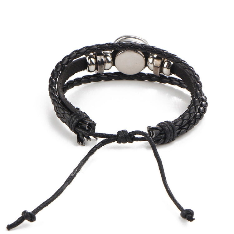 Black leather wrap bracelet with round metal accents and turquoise zodiac charm