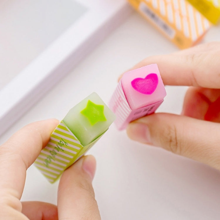 Long striped love erasers held in hands, pink heart and green star-shaped top