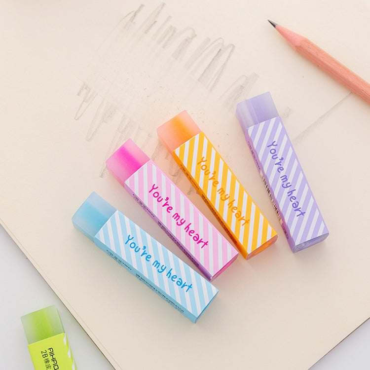 Long striped love erasers scattered on paper, assorted pastel colors