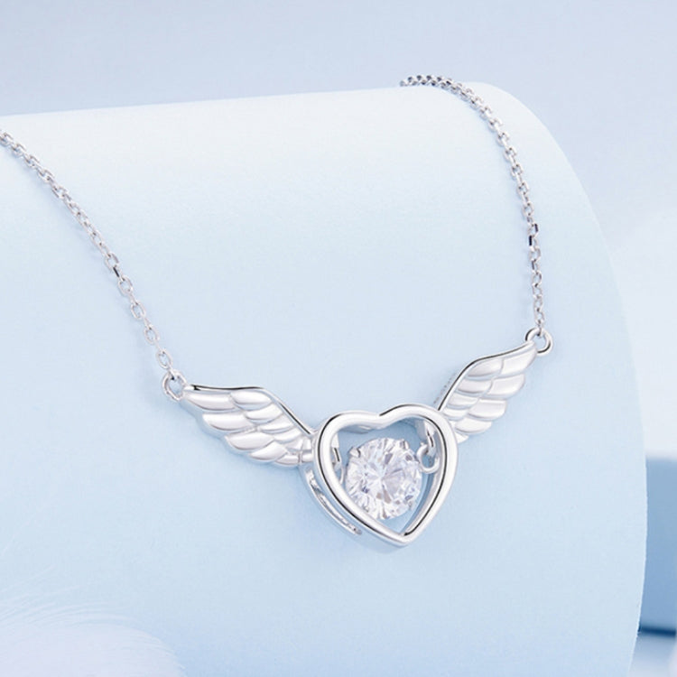Silver heart pendant necklace with round white zircon and small wing accents