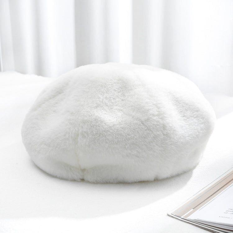 Plush women’s beret hat, white color, soft fuzzy texture.