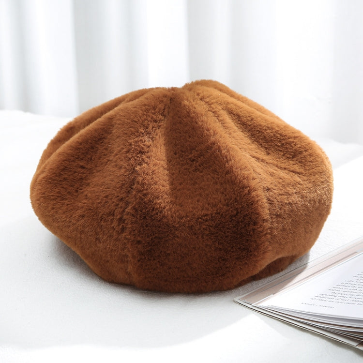 Plush women’s beret hat, caramel brown color, soft fuzzy texture.