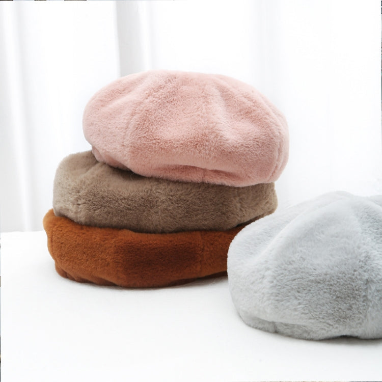 Plush beret hat stack in pink, beige, brown, and light gray colors.