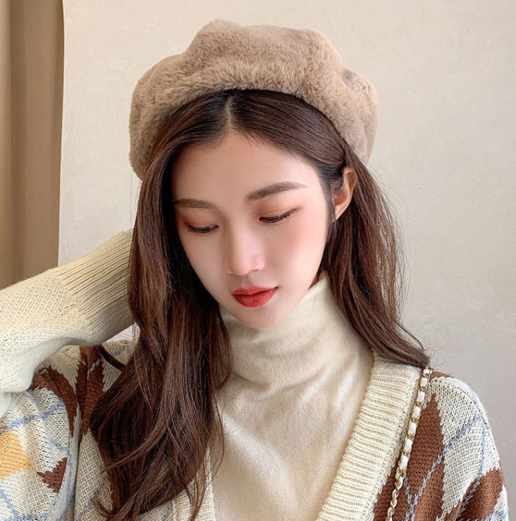 Plush beige beret hat with rounded crown and cozy fuzzy texture, adjustable fit