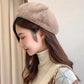Plush beige painter-style beret hat with rounded crown and fuzzy, warm lining