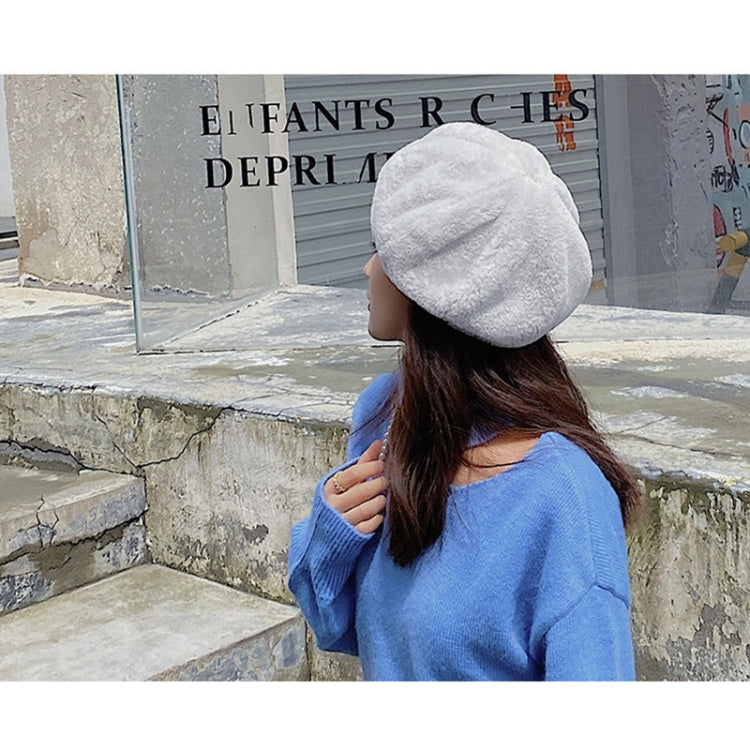 Plush light gray beret hat with rounded crown and fuzzy texture, adjustable fit