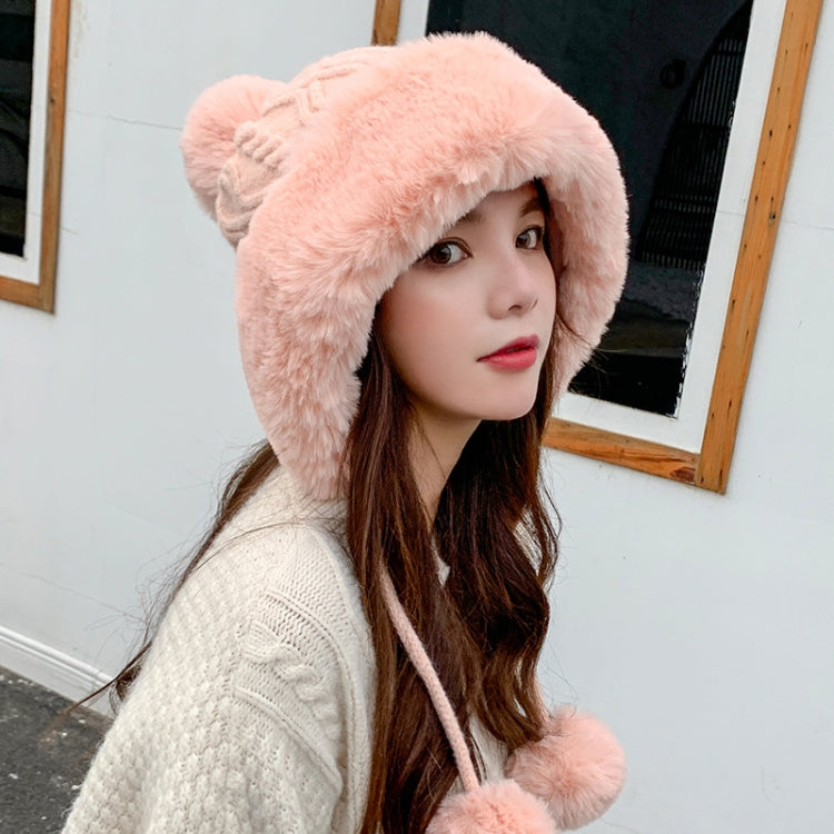 Pink faux-fur trimmed knitted skullcap with pom-pom ties on the sides