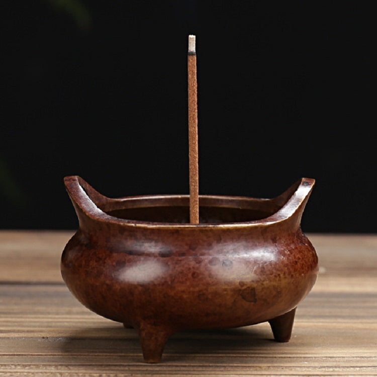 Antique copper incense burner with upright stick holder and three short legs