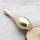Close-up of metallic gold mini vase opening with fitted incense stick holder