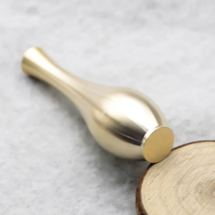 Close-up of metallic gold mini vase opening with fitted incense stick holder