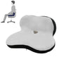 Petal-shaped memory foam cushion, light gray with black trim and raised center hole
