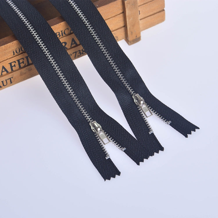 Pant zipper placket with dark blue tape and silver metal teeth, open end (set)