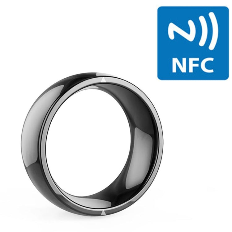 Glossy black smart ring close-up, circular profile