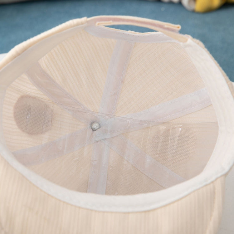 Beige baby sun hat interior view with lightweight mesh panel and button