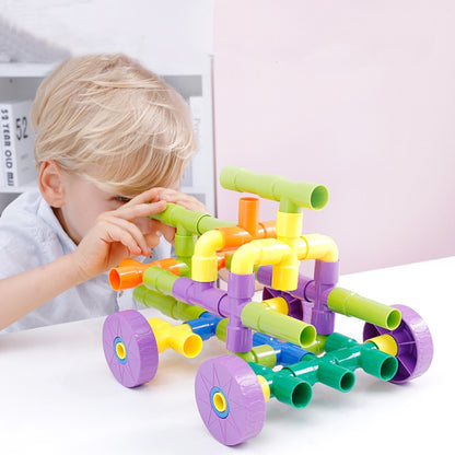 Colorful plastic pipe building blocks assembled into a small wheeled vehicle, multicolor